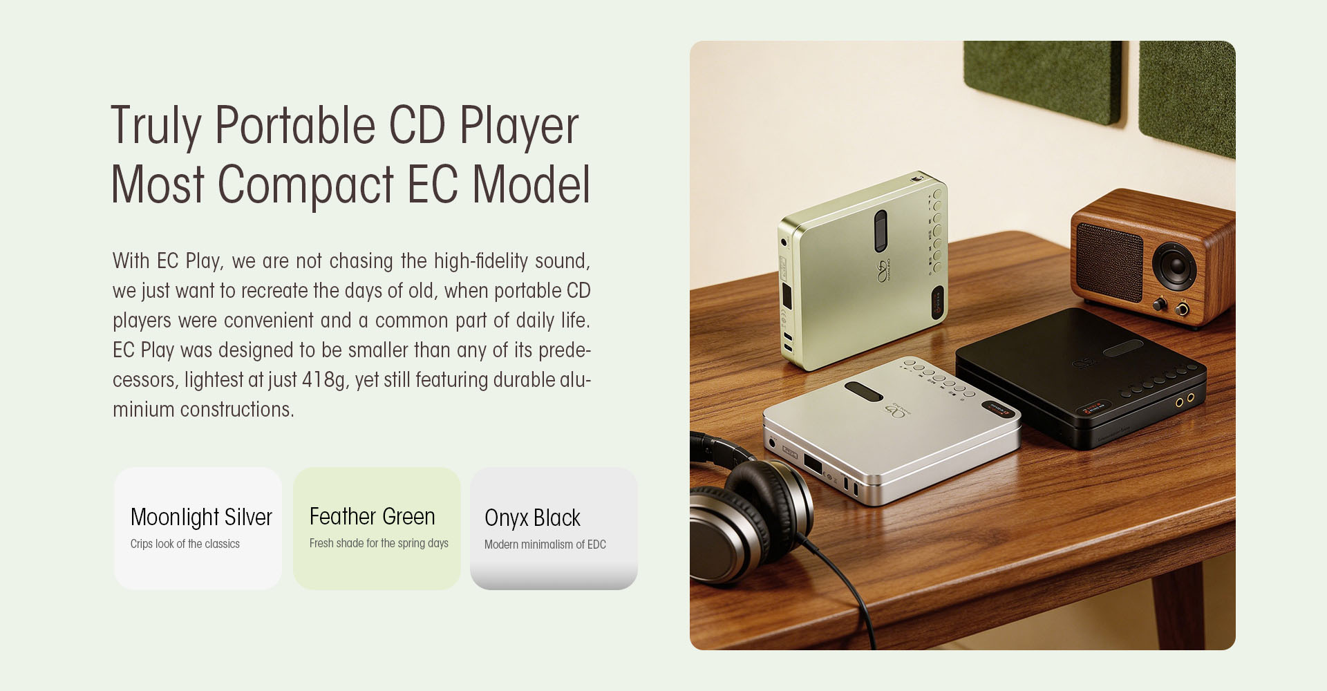 Shanling EC Play in three colours on a wooden desk, paired with headphones and a small speaker