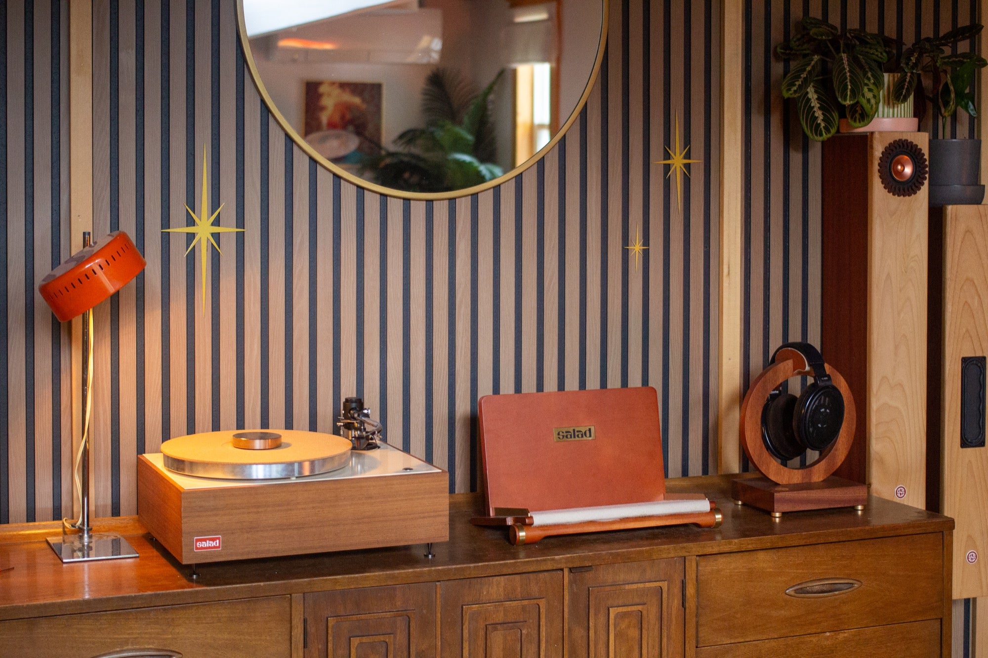 Salad Flip Vinyl Rack in a mid-century modern living room with an orange desk lamp, wooden turntable, and headphone stand