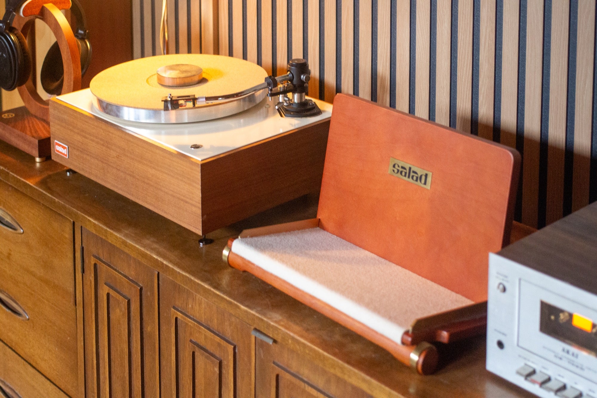 Salad Flip Vinyl Rack in a vintage wooden listening space alongside a matching Salad turntable and an Akai cassette deck