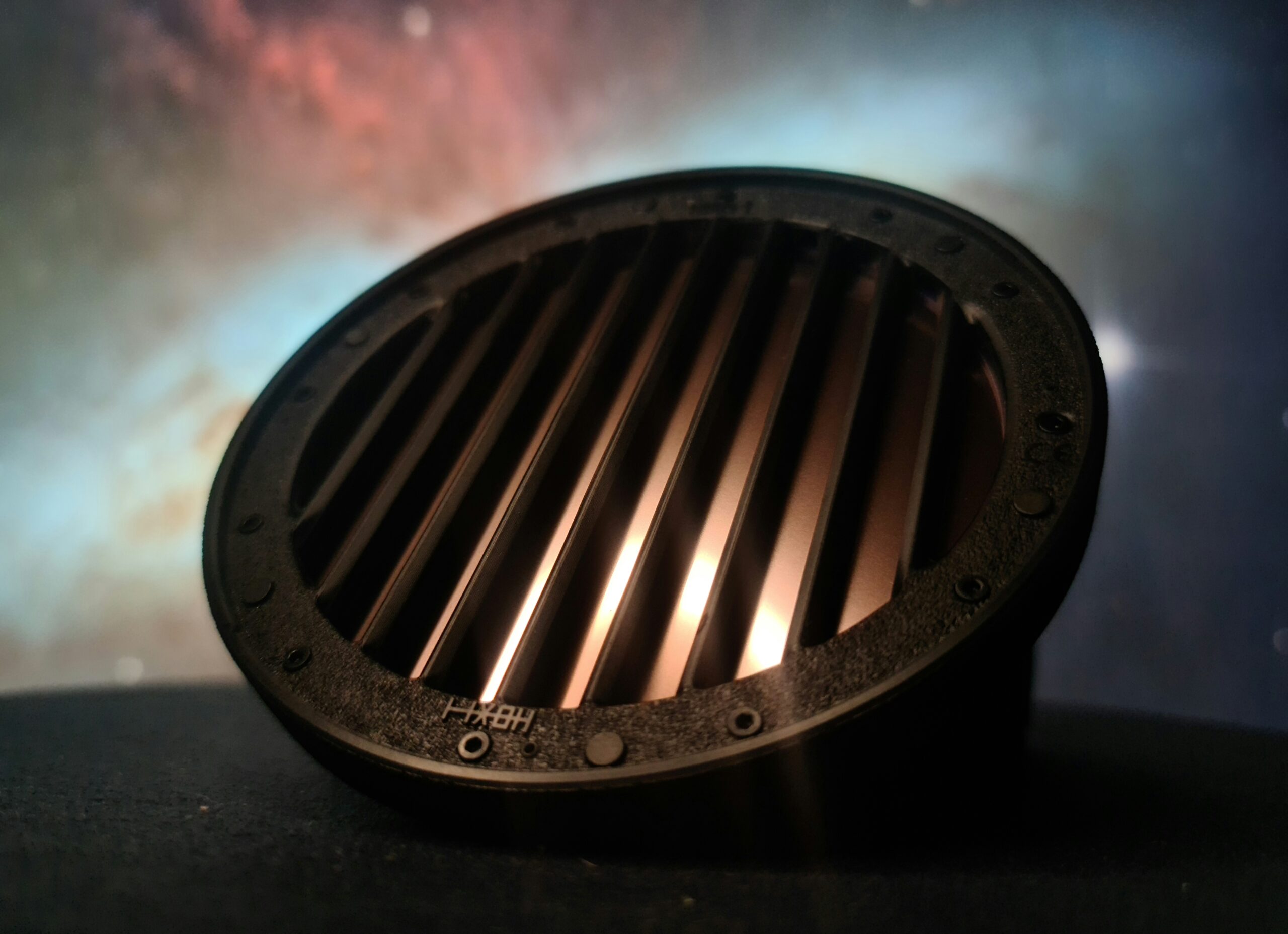 HOXIT AUDIO V1 open-back headphones low-angle close-up — showing vertical grille and industrial design details